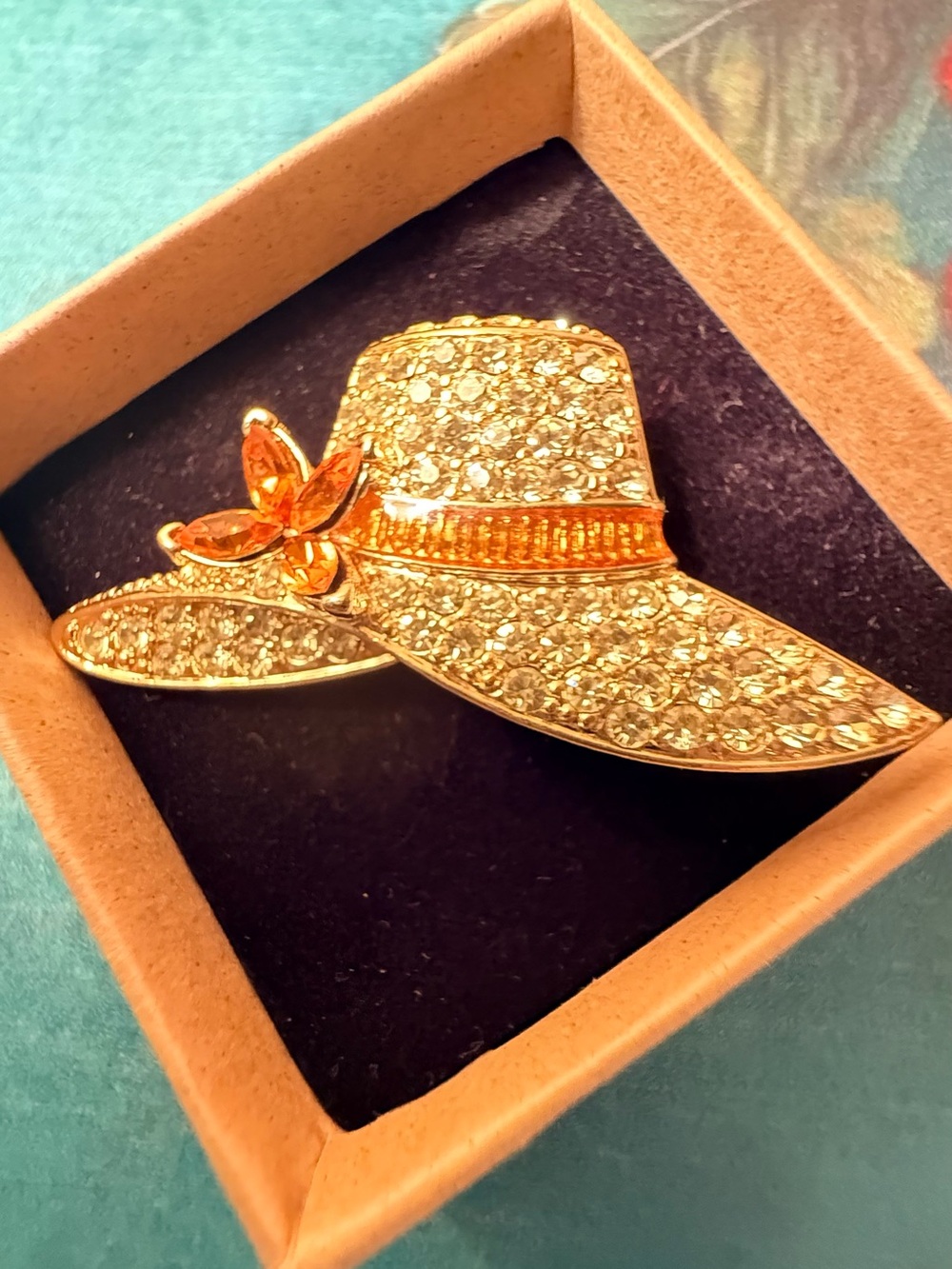 Gold-Tone Rhinestone Sun Hat Brooch with Orange Accent
